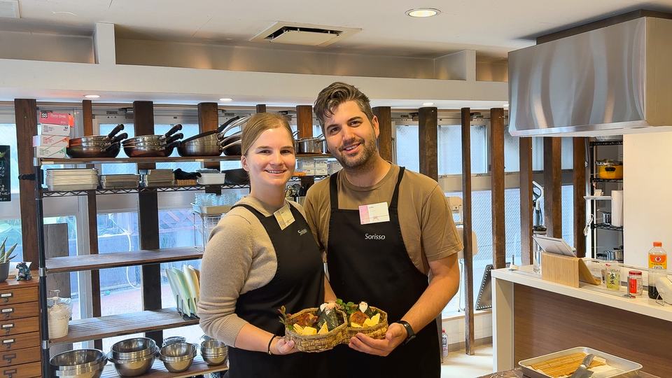 A couple with their onigiri and tamagoyaki bento