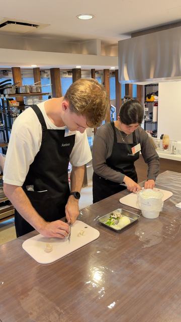 Guests chopping vegetables for omurice