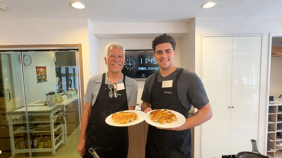Father and son with their pan-fried gyoza