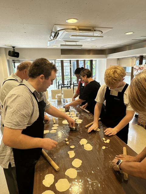 Guests rolling out gyoza dough