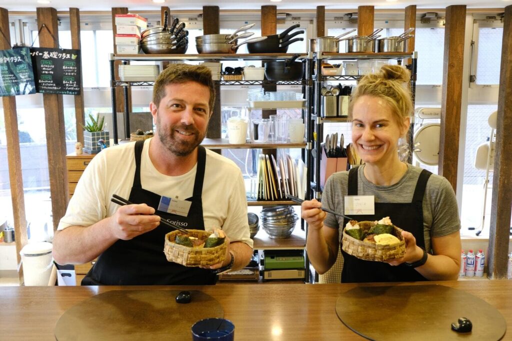 Guests enjoying the onigiri they made in a private Japanese cooking class